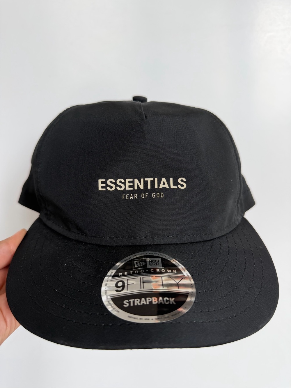New Era ESSENTIALS Black Strapback Hat